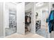 Hallway with laundry room and bathroom featuring updated fixtures and neutral paint at 105 Olde Liberty Dr, Youngsville, NC 27596