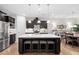 Modern kitchen with a large island, quartz countertops, and pendant lighting at 105 Olde Liberty Dr, Youngsville, NC 27596