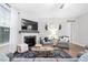 Charming living room featuring a fireplace, TV, comfortable armchairs and sofas, creating a cozy and inviting space at 105 Olde Liberty Dr, Youngsville, NC 27596
