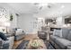 Bright and inviting living room with hardwood floors, comfortable seating, and an open layout, perfect for relaxation and gatherings at 105 Olde Liberty Dr, Youngsville, NC 27596