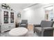 Comfortable living room featuring a bar cabinet, cozy seating, and a stylish ottoman at 105 Olde Liberty Dr, Youngsville, NC 27596