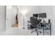 Cozy home office space with desk, computer monitors, and soft carpet flooring at 105 Olde Liberty Dr, Youngsville, NC 27596