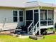 Inviting screened porch with outdoor seating and views of the backyard at 105 Olde Liberty Dr, Youngsville, NC 27596