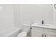 Bright bathroom featuring a shower/tub combination and a modern vanity with matte black faucet at 109 Faucette Ave, Burlington, NC 27215
