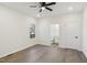 A light-filled bedroom with wood-look floors includes access to an ensuite bathroom at 109 Faucette Ave, Burlington, NC 27215