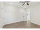 This bright bedroom boasts wood-look floors and easy access to closet space at 109 Faucette Ave, Burlington, NC 27215