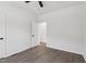 This bedroom boasts wood-look floors, neutral walls, and an open closet at 109 Faucette Ave, Burlington, NC 27215