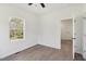 Bedroom with wood-look floors, natural light, and closet at 109 Faucette Ave, Burlington, NC 27215