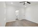 Spacious bedroom with ceiling fan, neutral walls, and ensuite bath at 109 Faucette Ave, Burlington, NC 27215