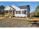 Neat single-story home with a cozy front porch and new landscaping enhancing curb appeal at 109 Faucette Ave, Burlington, NC 27215