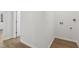 Laundry room with convenient hookups, wood-look flooring, and neutral paint at 109 Faucette Ave, Burlington, NC 27215