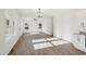 Bright open floor plan with ample sunlight, light wood floors and connecting to the kitchen area at 109 Faucette Ave, Burlington, NC 27215