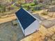 Aerial view showing home and new deck, plus straw-covered lawn and nice roof at 111 Faucette Ave, Burlington, NC 27215