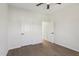 A bedroom with neutral colors, ceiling fan, and wood floors at 111 Faucette Ave, Burlington, NC 27215