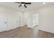 Bright bedroom with an ensuite bathroom, ceiling fan, and neutral colored walls at 111 Faucette Ave, Burlington, NC 27215