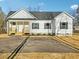 New home with white siding and black shutters at 111 Faucette Ave, Burlington, NC 27215