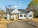 New construction home with white siding, black shutters and new roof at 111 Faucette Ave, Burlington, NC 27215