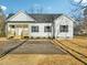 New home with white siding and black shutters at 111 Faucette Ave, Burlington, NC 27215