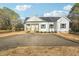 Charming one story home features a welcoming front porch and spacious front yard at 111 Faucette Ave, Burlington, NC 27215