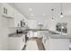 Modern kitchen featuring white cabinetry, granite countertops, and stainless steel appliances at 111 Faucette Ave, Burlington, NC 27215