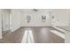 Bright living room features modern flooring, ceiling fan, and plenty of natural light at 111 Faucette Ave, Burlington, NC 27215