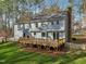 Image displays a lovely backyard with a spacious deck, perfect for outdoor relaxation at 1113 Harvest Mill Ct, Raleigh, NC 27610