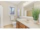 Bathroom with a wooden vanity, and a large mirror at 1113 Harvest Mill Ct, Raleigh, NC 27610