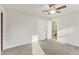 Bedroom featuring neutral carpet, closet, and views to stairwell at 1113 Harvest Mill Ct, Raleigh, NC 27610
