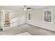 Bedroom featuring neutral carpet, windows, and ample natural light at 1113 Harvest Mill Ct, Raleigh, NC 27610