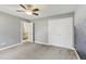 Bedroom featuring light gray walls, carpet flooring, a ceiling fan, and a closet at 1113 Harvest Mill Ct, Raleigh, NC 27610