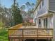 Spacious wooden deck with railings, perfect for outdoor entertaining with a backyard and home view at 1113 Harvest Mill Ct, Raleigh, NC 27610