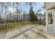 Large wood deck perfect for outdoor entertaining with wood railing at 1113 Harvest Mill Ct, Raleigh, NC 27610