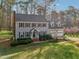 Charming home with a manicured lawn, complemented by a two-car garage and mature trees at 1113 Harvest Mill Ct, Raleigh, NC 27610