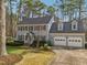 Exterior view of a beautiful home with a two-car garage and well-maintained landscaping at 1113 Harvest Mill Ct, Raleigh, NC 27610