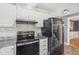 Bright kitchen featuring white cabinetry and stainless steel appliances at 1113 Harvest Mill Ct, Raleigh, NC 27610