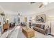 Inviting living room with access to the backyard, natural light, ceiling fans, and a cozy seating area at 1113 Harvest Mill Ct, Raleigh, NC 27610