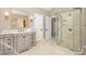 Bathroom with a glass walk-in shower, vanity, and ample lighting at 116 Galway Dr, Chapel Hill, NC 27517