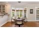 Charming breakfast nook with a round table, bay windows, and cozy seating at 116 Galway Dr, Chapel Hill, NC 27517