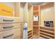 Walk-in closet with custom built-in shelving and drawers for optimal organization at 116 Galway Dr, Chapel Hill, NC 27517