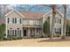 Traditional two-story home with a manicured lawn, neutral siding, and black shutters for a classic curb appeal at 116 Galway Dr, Chapel Hill, NC 27517