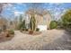 Charming two-story home with a well-manicured yard and a circular driveway at 116 Galway Dr, Chapel Hill, NC 27517