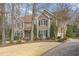 Beautiful two-story home with manicured lawn, mature trees, and a welcoming driveway at 116 Galway Dr, Chapel Hill, NC 27517