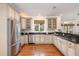 Spacious kitchen featuring stainless steel appliances, granite countertops, and custom cabinets at 116 Galway Dr, Chapel Hill, NC 27517