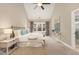 Serene main bedroom features vaulted ceilings, a plush bed, and soft natural light at 116 Galway Dr, Chapel Hill, NC 27517