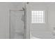 Bright bathroom featuring a shower, soaking tub and window for natural light at 117 Talley Ridge Dr, Holly Springs, NC 27540