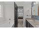 Granite sink with black interior door looking into the tray ceiling bedroom at 117 Talley Ridge Dr, Holly Springs, NC 27540