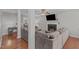 Spacious living room featuring hardwood floors, a cozy fireplace, and a large sectional sofa at 117 Talley Ridge Dr, Holly Springs, NC 27540