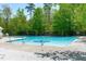 Community pool with sparkling blue water, perfect for relaxing on sunny days at 117 Talley Ridge Dr, Holly Springs, NC 27540