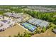 Community featuring tennis and pickleball courts, clubhouse, and scenic landscaping for active lifestyle at 1214 Gaston Manor Dr, Durham, NC 27703