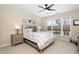 Comfortable bedroom features neutral tones, large windows, and ceiling fan at 1214 Gaston Manor Dr, Durham, NC 27703